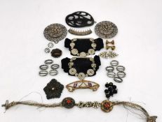 A collection of antique hair pieces and buckles and buttons, including a silver filigree hair