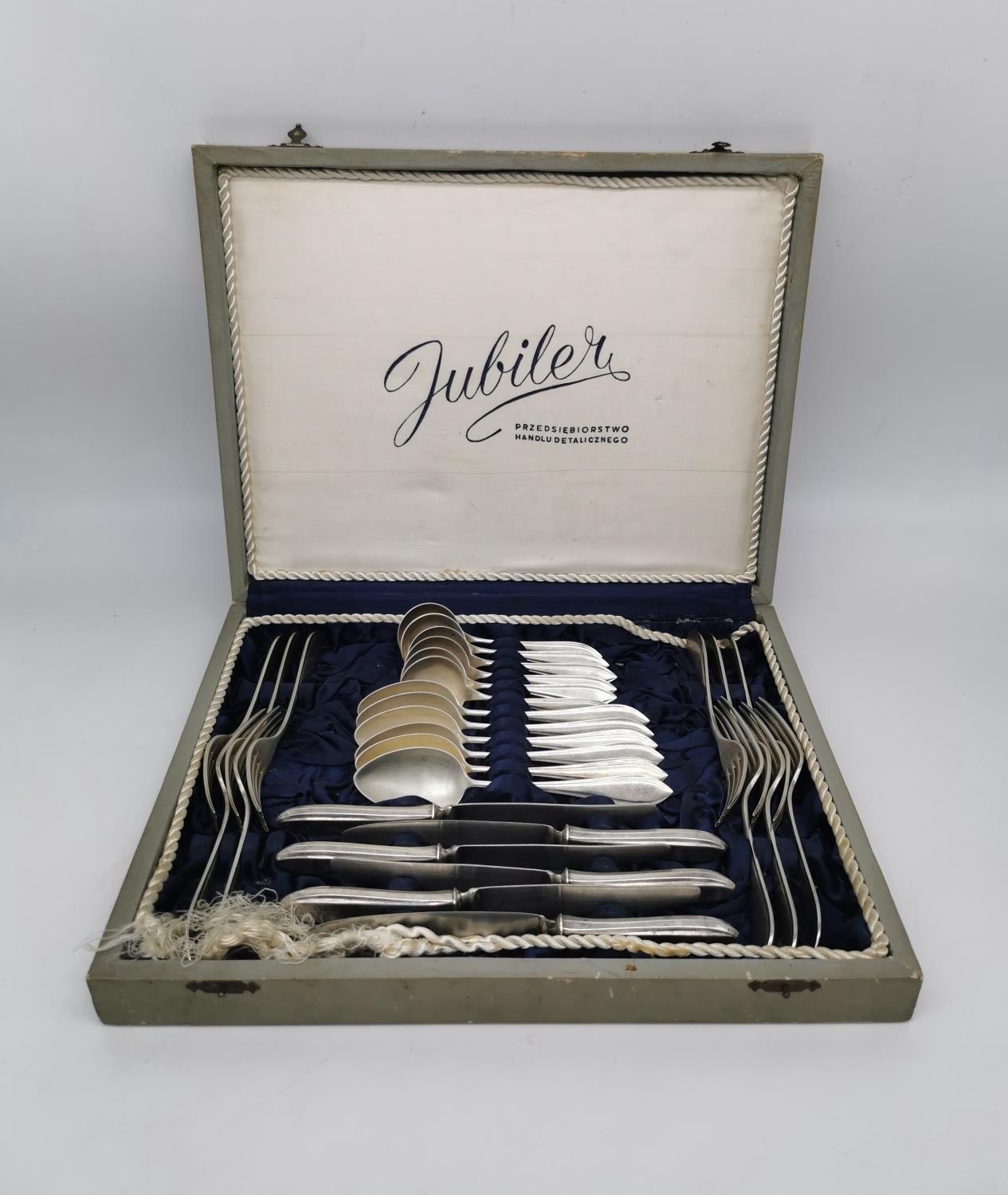 A cased set of German 835 silver cutlery for six people. Each piece stamped 835. Manufacturer's name