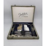 A cased set of German 835 silver cutlery for six people. Each piece stamped 835. Manufacturer's name