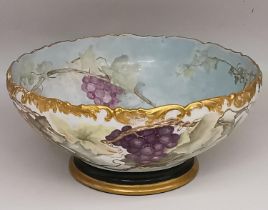 A Victorian T&V (Tressemann and Vogt) Limoges hand painted porcelain punch bowl. Decorated with