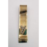 A yellow metal (tests as 9ct) yellow gold and diamond money clip. The clip adorned with the letter Y