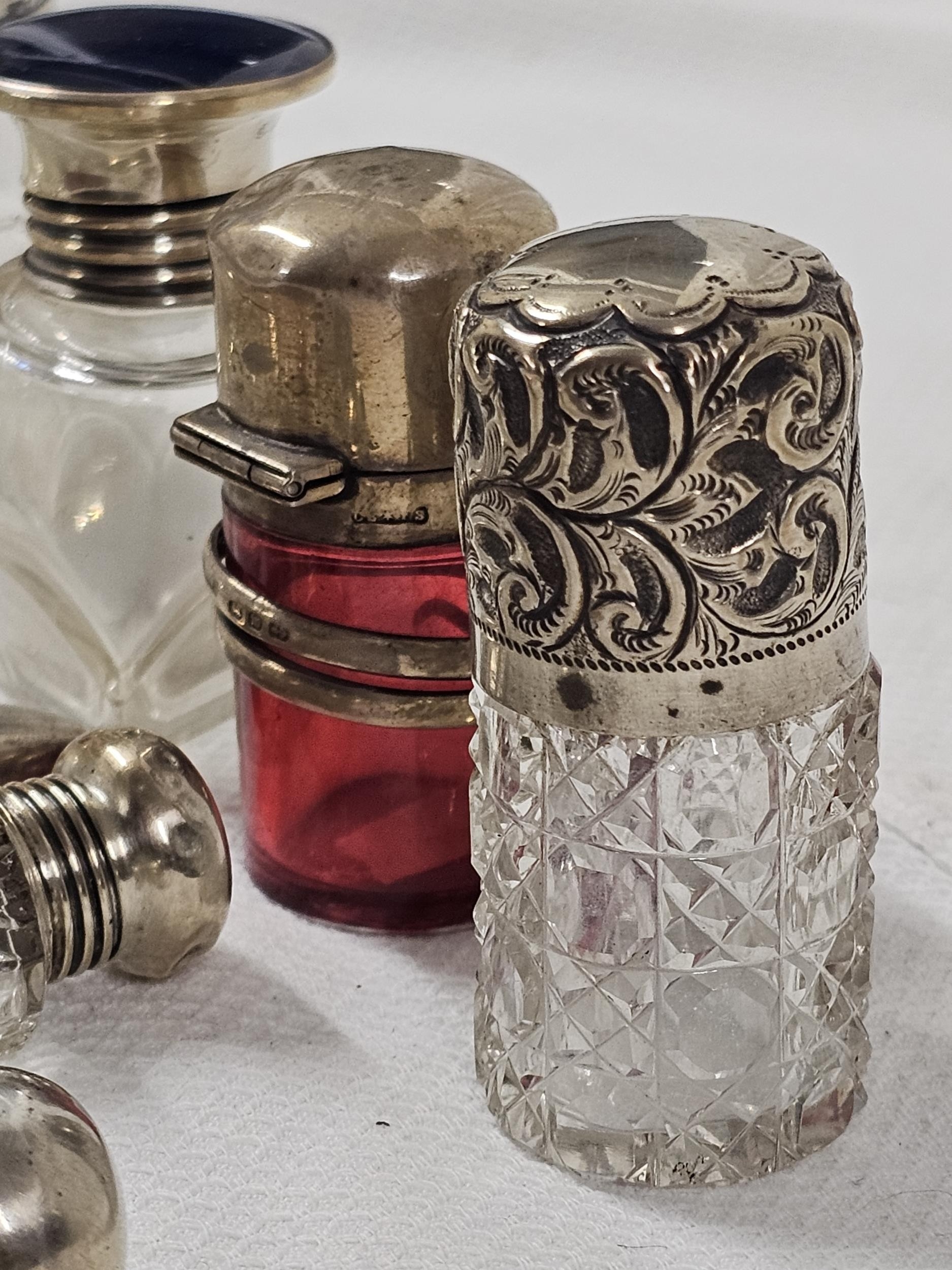 A collection of nine 19th century and early 20th century silver and white metal topped and perfume - Image 4 of 4