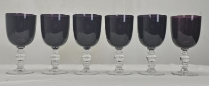 A set of six William Yeoward amethyst coloured crystal wine glasses with clear stems. Note that