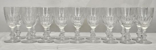 A set of eighteen Villeroy and Boch crystal Bernadotte pattern wine glasses with petal faceting. H.