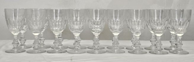 A set of eighteen Villeroy and Boch crystal Bernadotte pattern wine glasses with petal faceting. H.