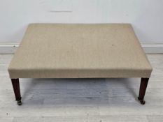 A large late 19th century mahogany hearth stool on square tapering supports terminating in brass