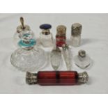 A collection of nine 19th century and early 20th century silver and white metal topped and perfume