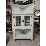 A late 19th century painted Arts and Crafts corner cabinet. H.175 W.100 D.60cm.