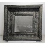 A large contemporary Baroque style metal wall mirror fitted with a faux aged glass plate. H.140 W.