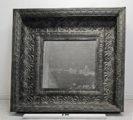 A large contemporary Baroque style metal wall mirror fitted with a faux aged glass plate. H.140 W.