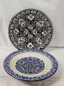 Two Moroccan hand painted bowl with stylised floral design. W.41cm.