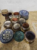 A collection of Turkish and Moroccan hand painted ceramics, including bowls and large plates. Each