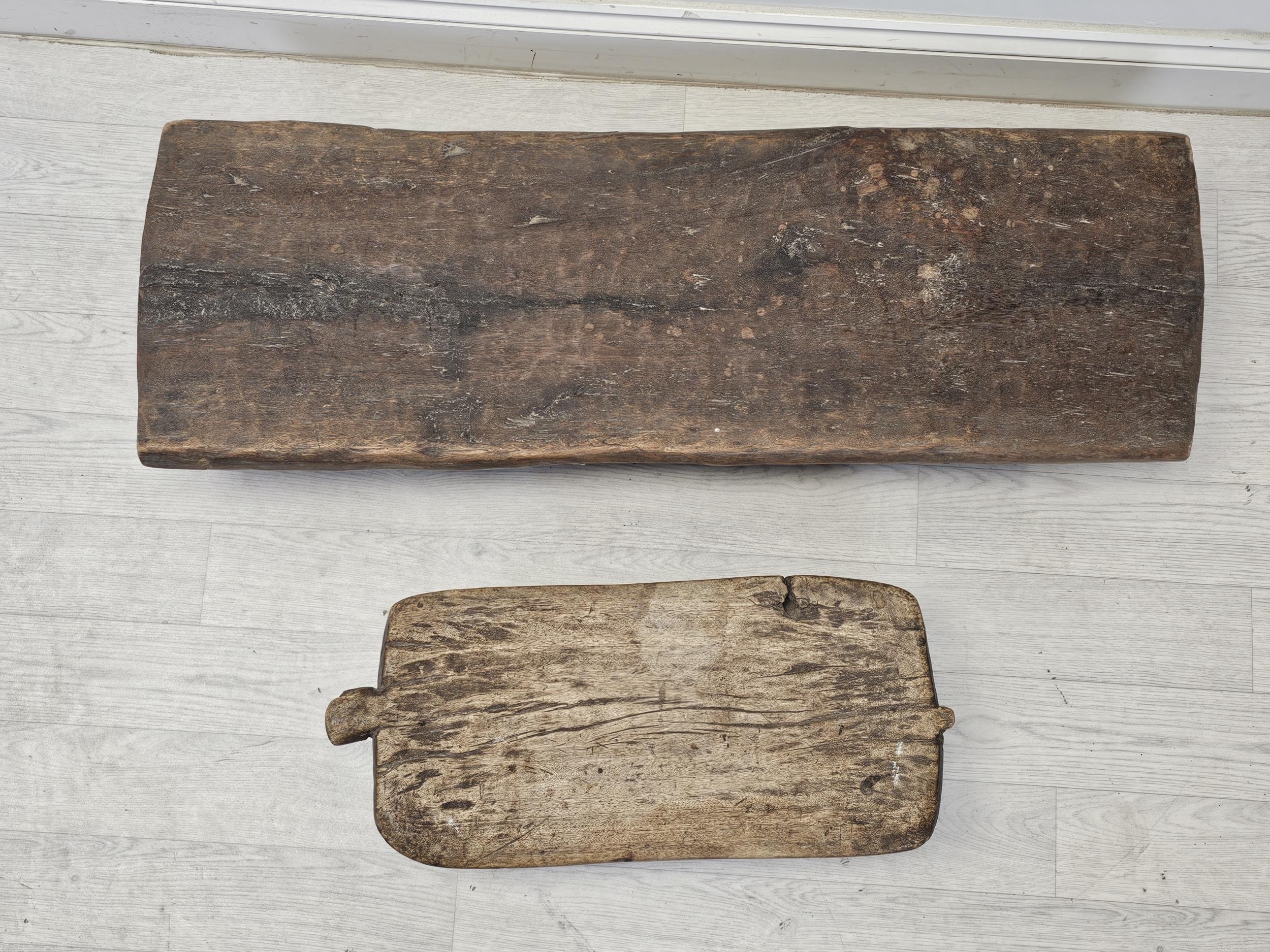 A 19th century African hardwood low stool along with a head rest. Possibly Senufo. Largest is W. - Image 4 of 4