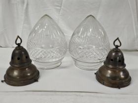 Two early 20th century bronze effect hanging ceiling lights with cut crystal acorn form shades. H.28