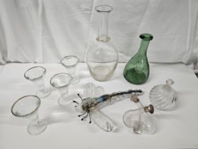 A collection of glass, including a Murano glass dragonfly, a silver topped oil and vinegar bottle