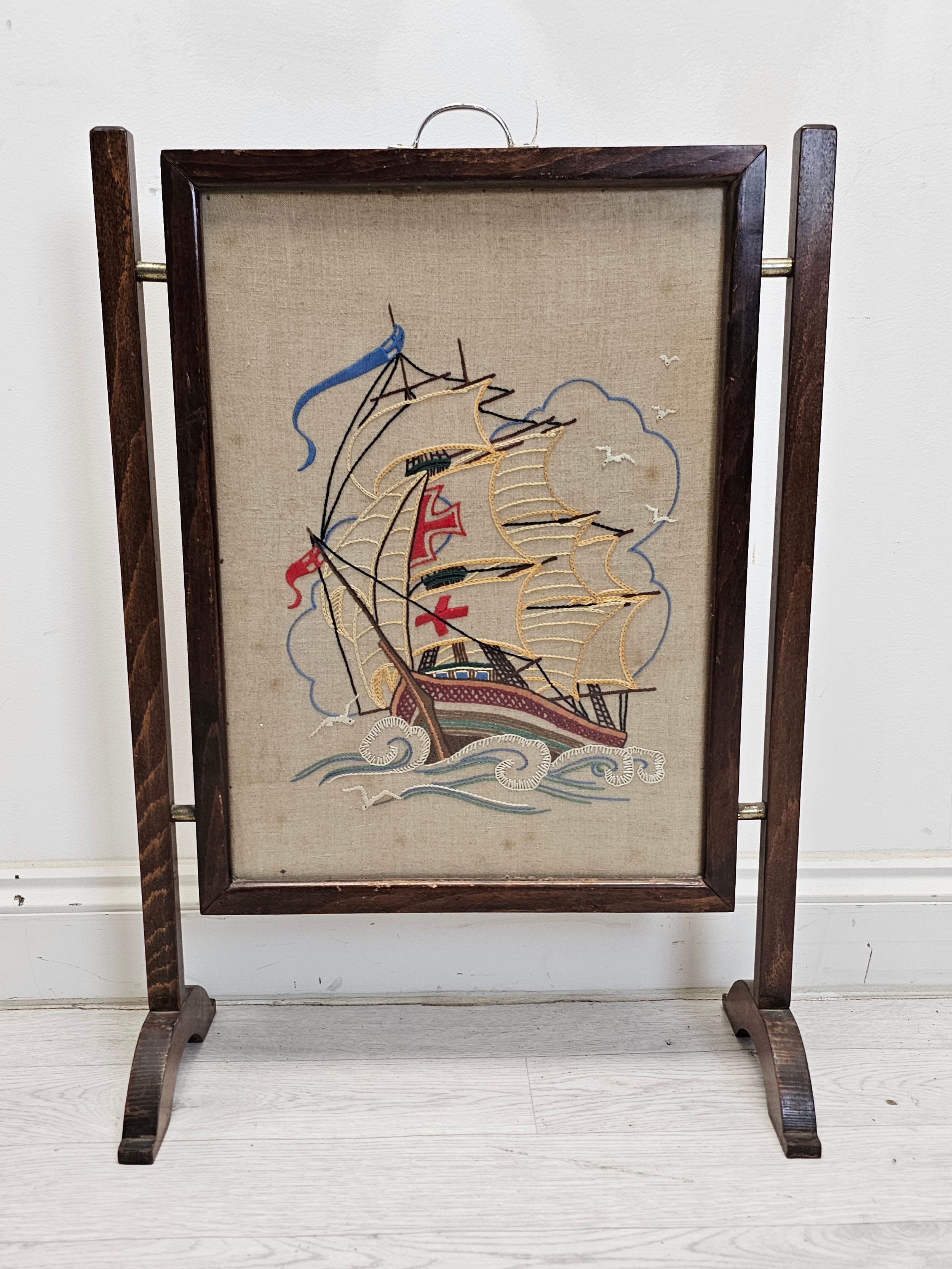 A mid century glazed tapestry fire guard. H.72 W.50cm.