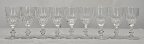 A set of nine Villeroy and Boch crystal Bernadotte pattern wine glasses with petal faceting. H.15.