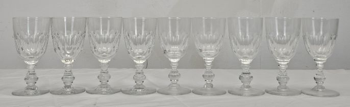 A set of nine Villeroy and Boch crystal Bernadotte pattern wine glasses with petal faceting. H.15.