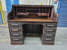 A late 19th century oak roll top desk. H.150 W.138 D.77cm.