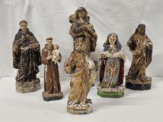 A collection of 17th/18th and 19th century carved and painted religious figures, some with gilt