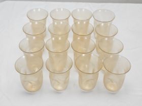 A collection of sixteen hand blown Venetian Murano Avventurina glass tumblers. Each one of a