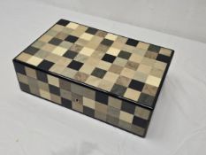 HERMES- A checkerboard marquetry jewellery box in hues of browns and blacks, pale wood liner and