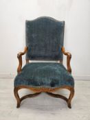 Armchair, 18th century French Provincial carved walnut in studded upholstery. H.110 W.60 D.68cm.