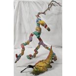 Two pieces of hand painted driftwood art, a pelican and leaf mask. Tallest H.80cm.