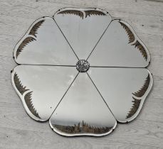 Art Deco wall mirror, vintage of flowerhead form with faux tortoiseshell inlaid decoration. H.65 W.