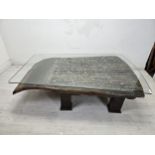 A large coffee table with plate glass top, reclaimed from an antique sleigh. H.46 W.170 D.115cm.