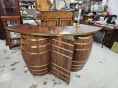 Home corner bar, mid century in the form of coopered oak barrels. H.110 W.210 D.60cm.