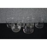 A collection of six early 20th century wine glass washers. H.10cm. (largest)