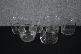 A collection of six early 20th century wine glass washers. H.10cm. (largest)