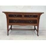 An Edwardian mahogany and satinwood chest of drawers. H.78 W.112 D.57cm. (Previously with fitted