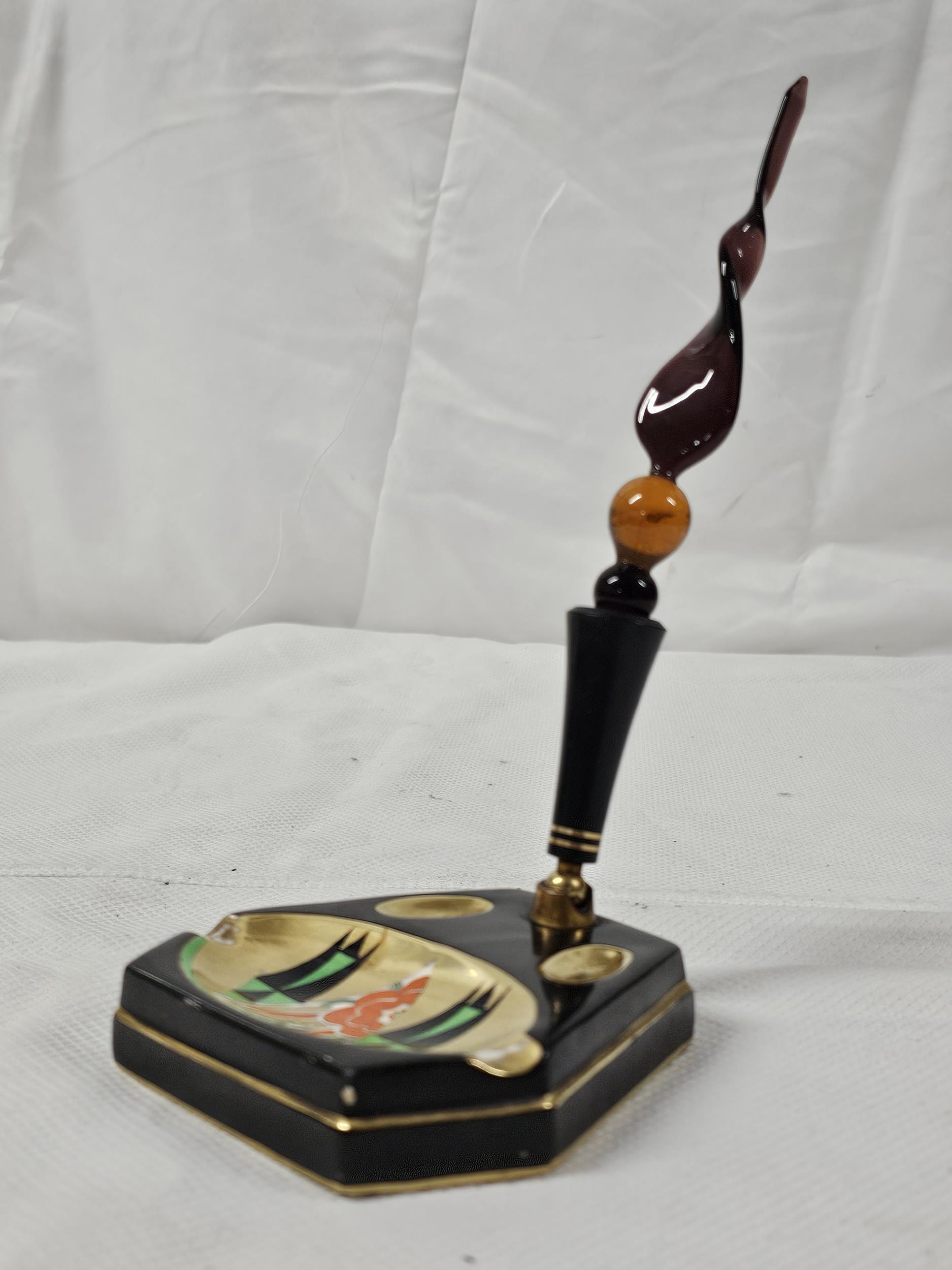 An Art Deco Crown Devon, gilt and abstract design pen stand with twist art glass dip pen. H.20cm.