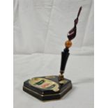 An Art Deco Crown Devon, gilt and abstract design pen stand with twist art glass dip pen. H.20cm.