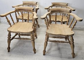 Bow back armchairs, a set of four C.1900 with saddle seats on turned stretchered supports. H.80 W.68