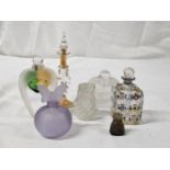 A collection of perfume bottles, including a hand painted 19th century scent bottle, a frosted mauve