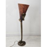 A French brass standard lamp, after a design by Edgar Brandt. Cast as a coiled cobra with a Verre De