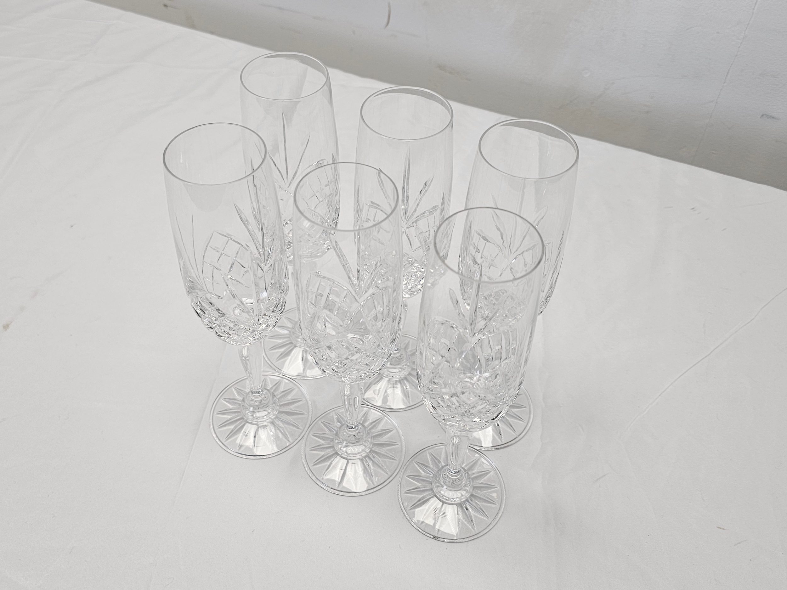 A set of six hand cut crystal champagne flutes with stylised floral design. H.22cm - Image 2 of 5