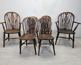 A set of six 19th century Windsor wheelback chairs to include two carver armchairs. (One chair is