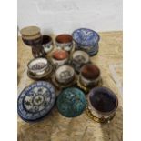 A collection of Turkish and Moroccan hand painted ceramics, including bowls and large plates. Each