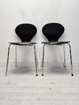 A pair of mid century Arne Jacobsen style stacking chairs. H.85 W.44 D.48cm.