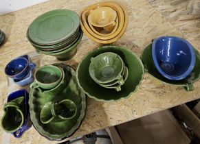 A collection of vintage French ceramic kitchenware, including soup bowls, serving dishes. Some