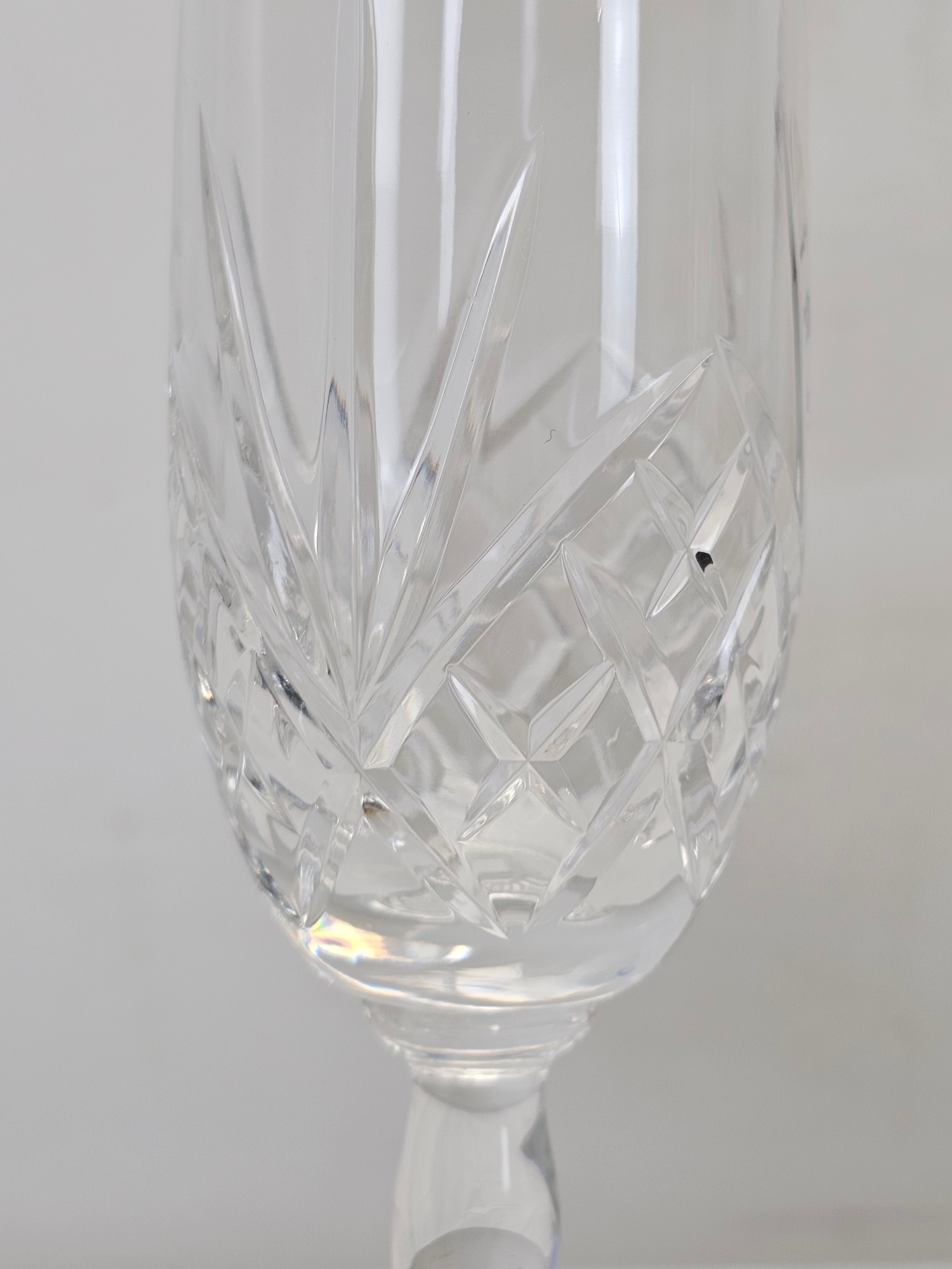 A set of six hand cut crystal champagne flutes with stylised floral design. H.22cm - Image 5 of 5