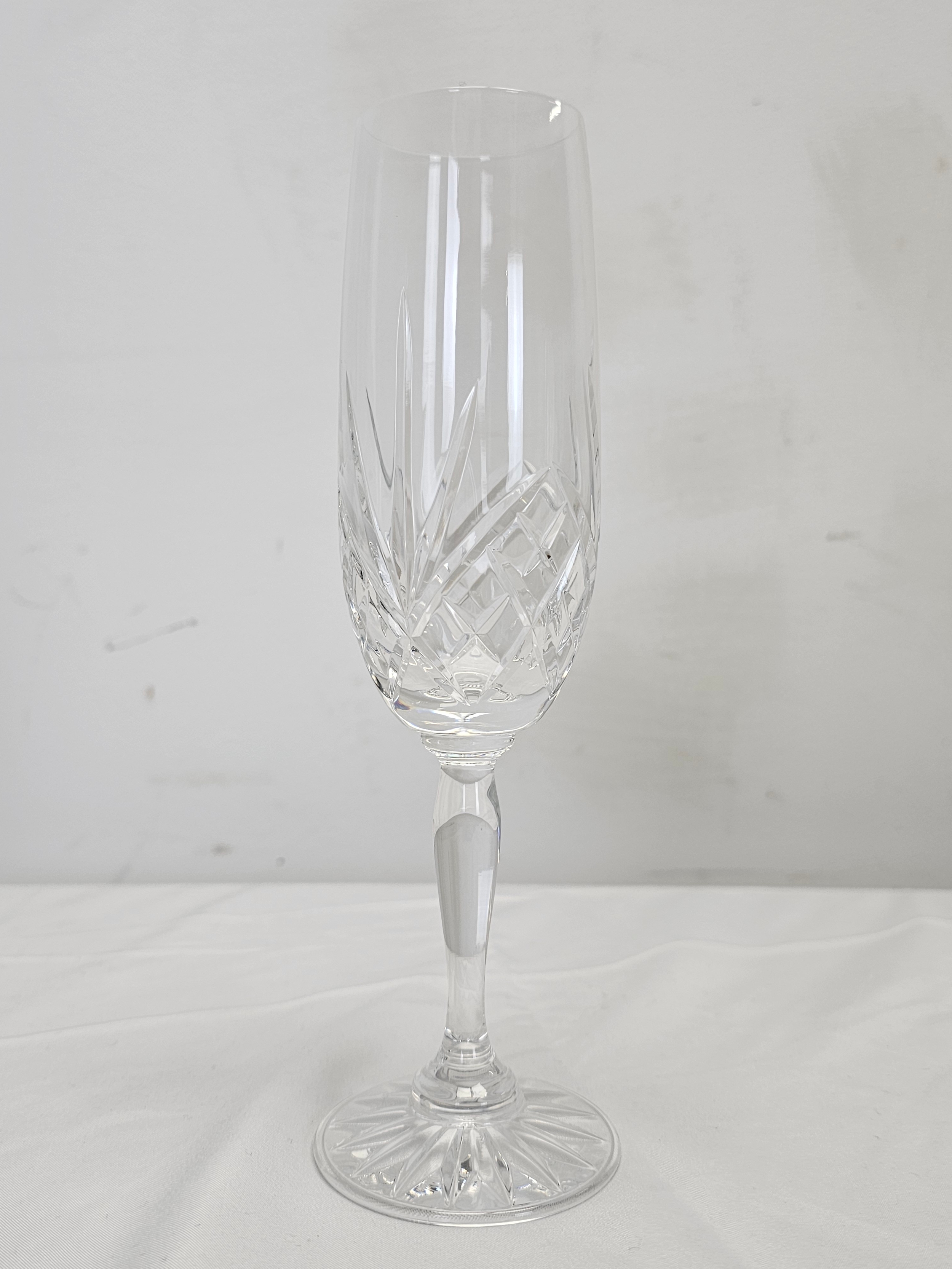 A set of six hand cut crystal champagne flutes with stylised floral design. H.22cm - Image 4 of 5