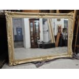 Wall mirror, large, contemporary distressed gilt frame with bevelled plate. H.213 W.150cm.