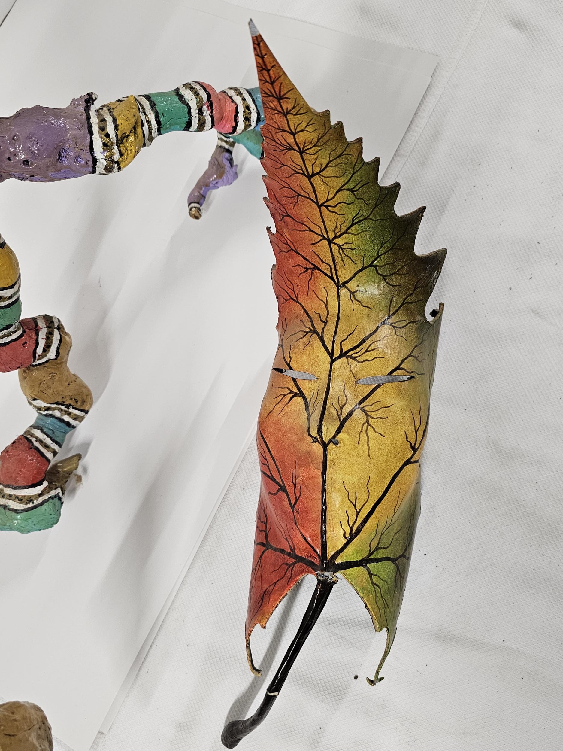 Two pieces of hand painted driftwood art, a pelican and leaf mask. Tallest H.80cm. - Image 2 of 3
