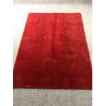 A contemporary hand knotted woollen rug. L.182 W.135cm.