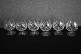 A set of six cut glass brandy glasses. H.13cm. (each)